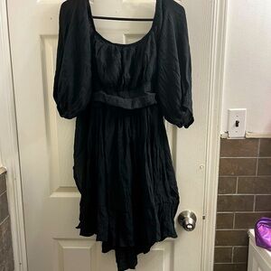 Women’s size medium black dress with tie in back.
